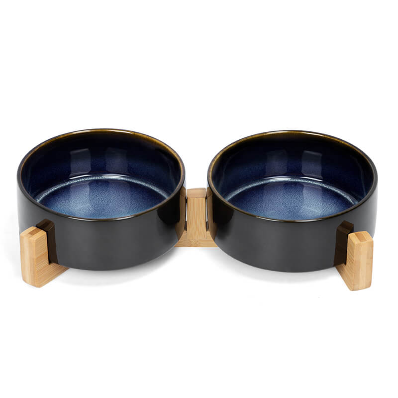 the front view of a ceramic dog bowl set with starry sky pattern